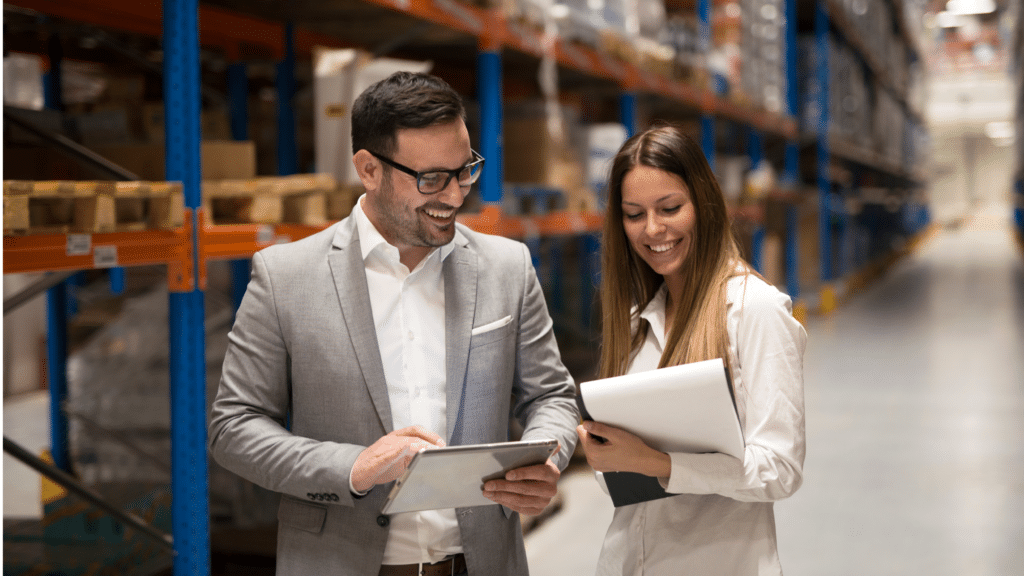 Warehouse managers reviewing inventory data