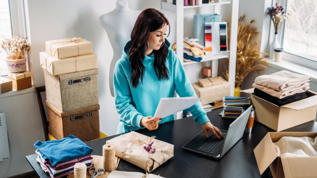 Woman reviewing product sales and profit in small business office