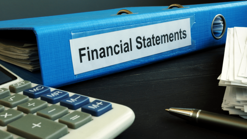 Financial statements folder with calculator and documents highlighting accounting review and risk detection.