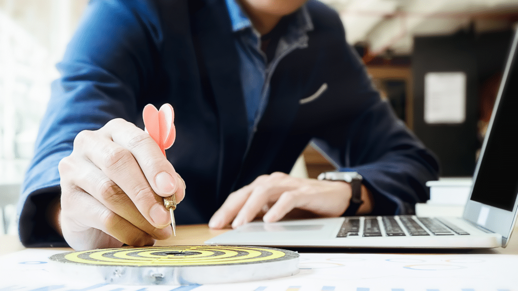 Business professional using a target to illustrate setting financial allocation percentages for a Profit First system.
