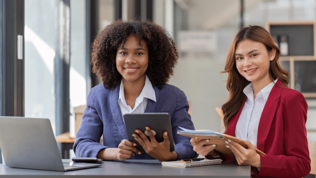 Two business professionals reviewing financial information and planning target allocations for a Profit First cash management system.
